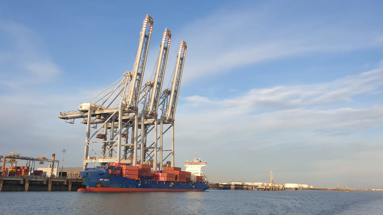 Container cranes over a ship docked at London Gateway port on the Thames in Thurrock.